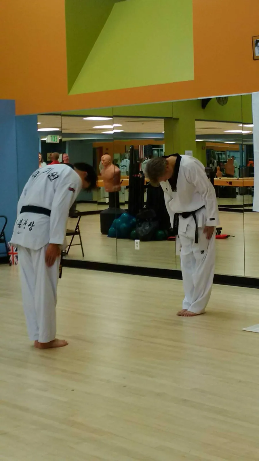 Two students bowing in class